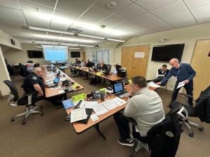 A group of people sitting at tables. 
